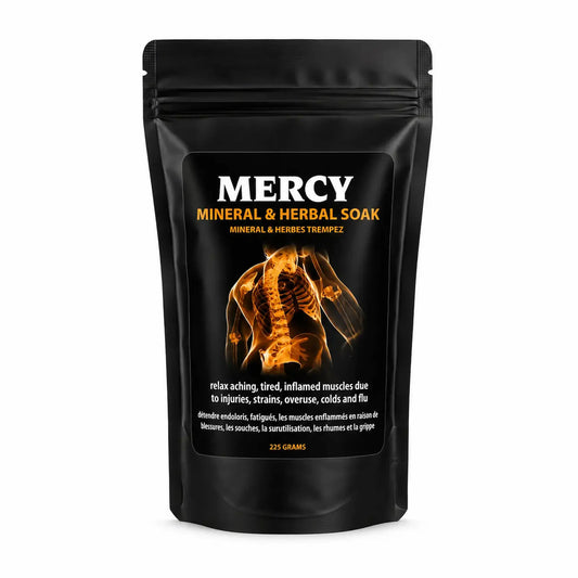 Black package of Mercy Mineral & Herbal Soak with skeleton illustration on a white background