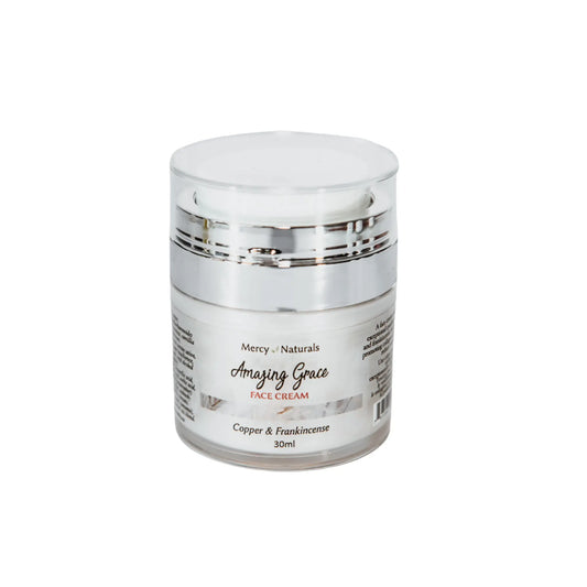 Jar of 'Amazing Grace' face cream with a silver lid on a white background