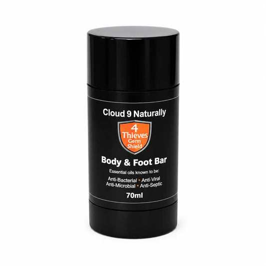 Black container of Cloud 9 Naturally 4 Thieves Germ Shield Body & Foot Bar on a white background