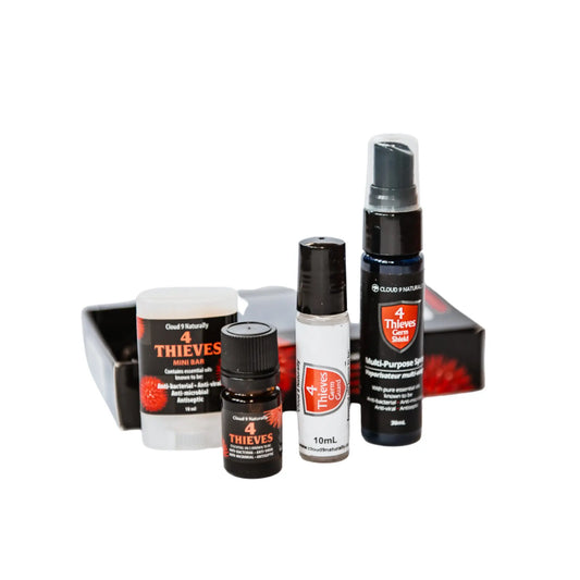 4 Thieves set with 30ml spray, rollerball, essential oil, body bar all on white background.