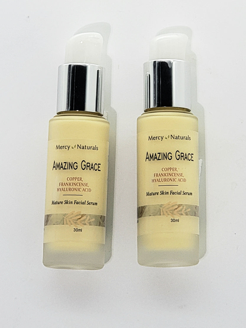 2 bottles of Amazing Grace Hyaluronic acid  serum 30 ml  frosted glass stuby bottle with a pump top.