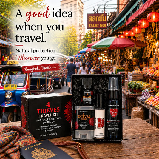 A travel kit set by 4 Thieves displayed in an open black box on a wooden table, with its retail box beside it. The background is a blurred street market scene in Bangkok, Thailand, with text overlay reading 'A good idea when you travel.