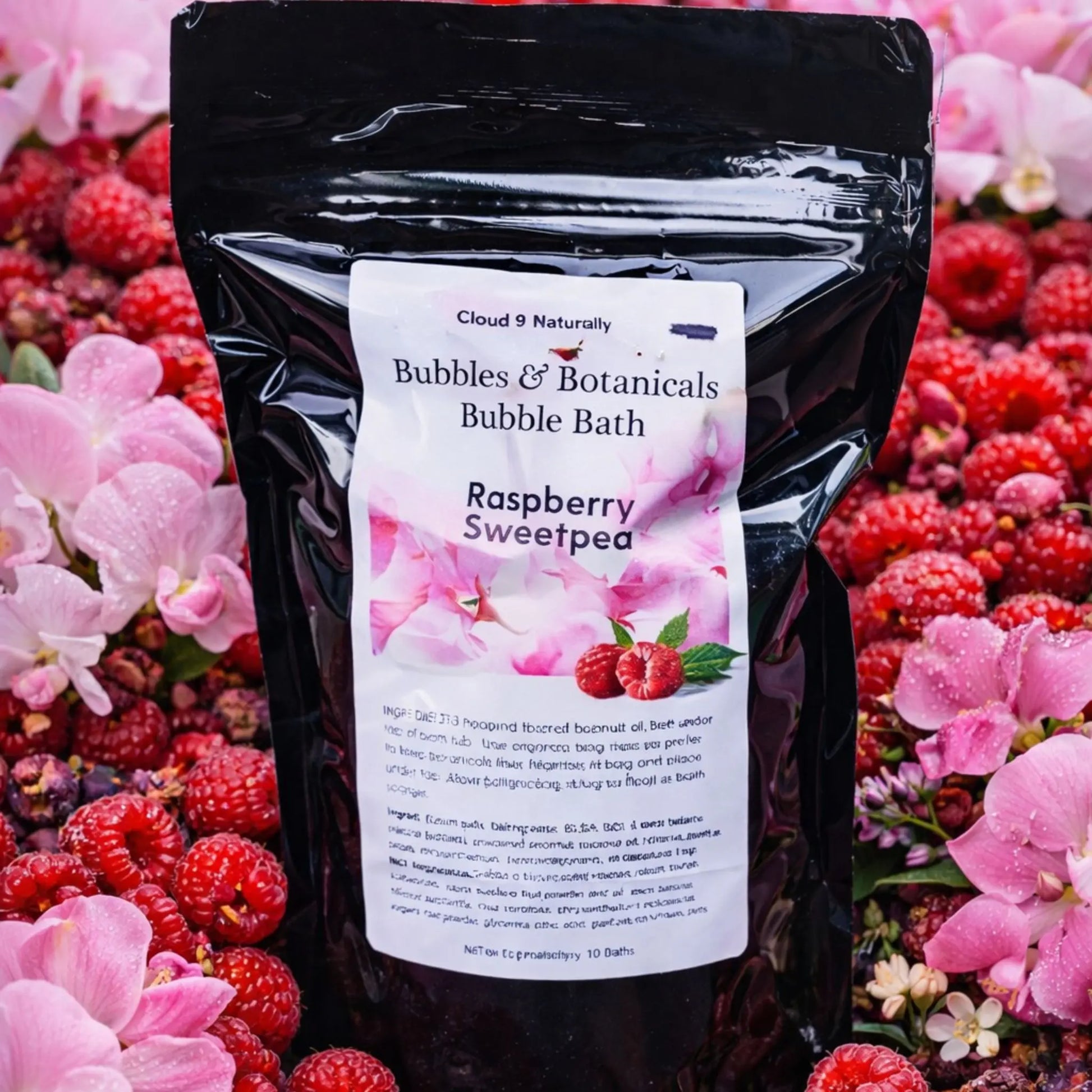 Raspberry Sweetpea Bubble Bath surrounded by raspberries and sweetpeas