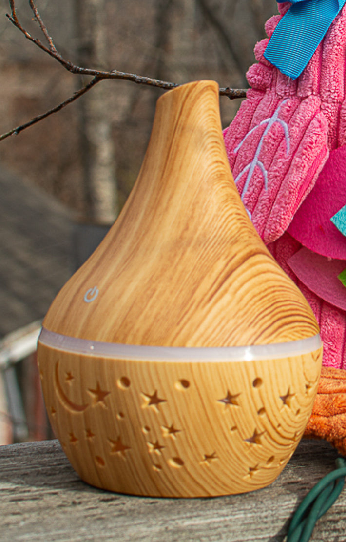 Mini Star and moon  plastic light wood look diffuser.
