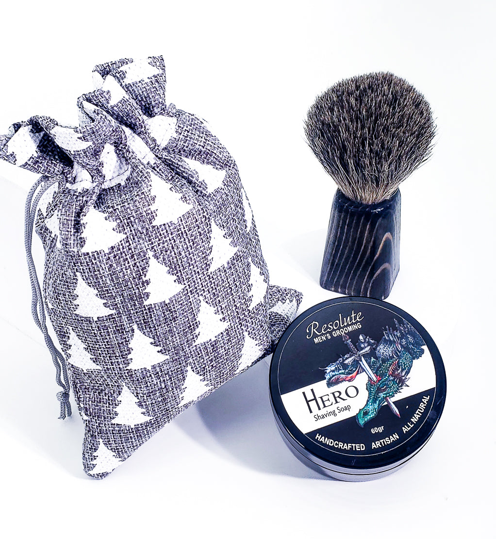 Shaving soap 60gr black plastic container a silver badger hair with black wooden handle brush set  in grey drawstring bag.  With tree imprint on bag. 